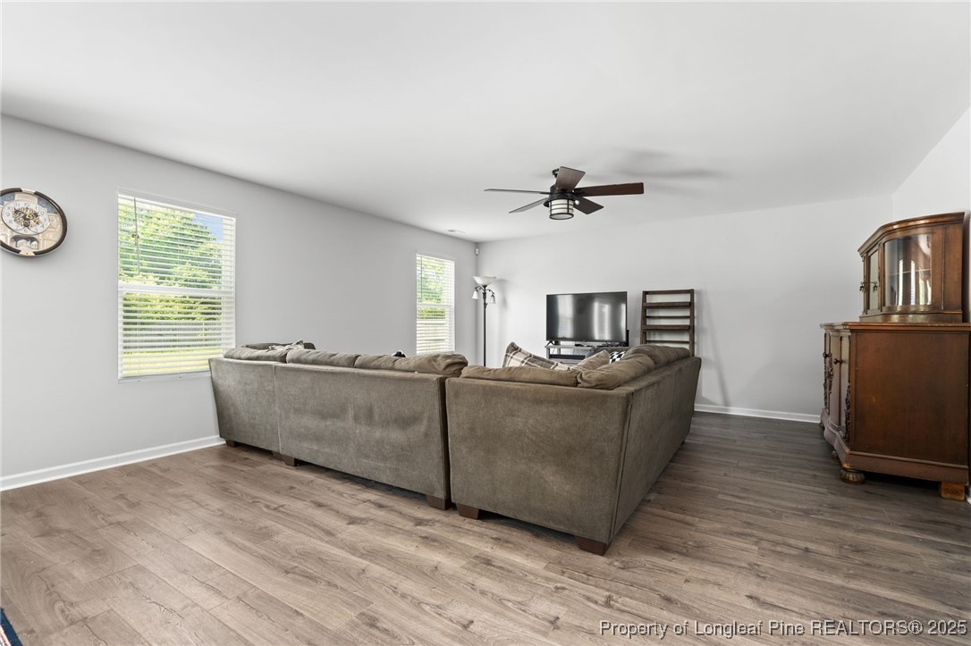 5926 Lowgrass Road Stedman, NC 28391 - Photo 8 of 39 a living room with furniture and a window