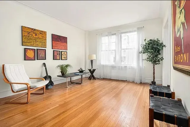 a living room with furniture and a window