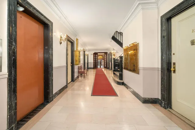 a view of a living room with a hallway