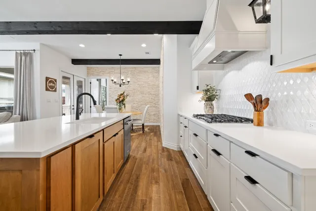 a spacious bathroom with a double vanity sink and a mirror