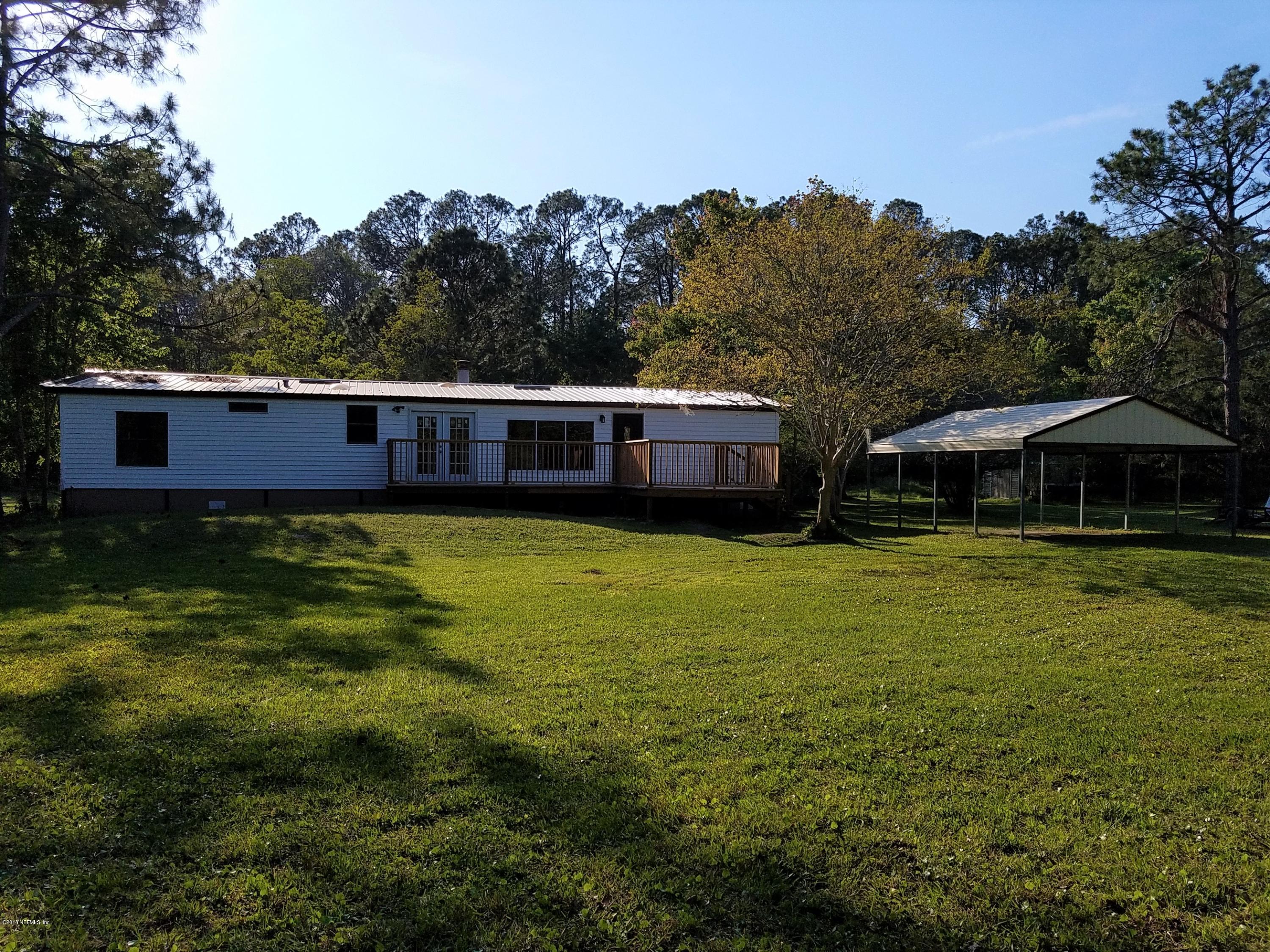 2801 Green Acres Road, Unit EXTENSION St. Augustine, FL 32084 - Photo 1 of 30 a view of a house with a garden