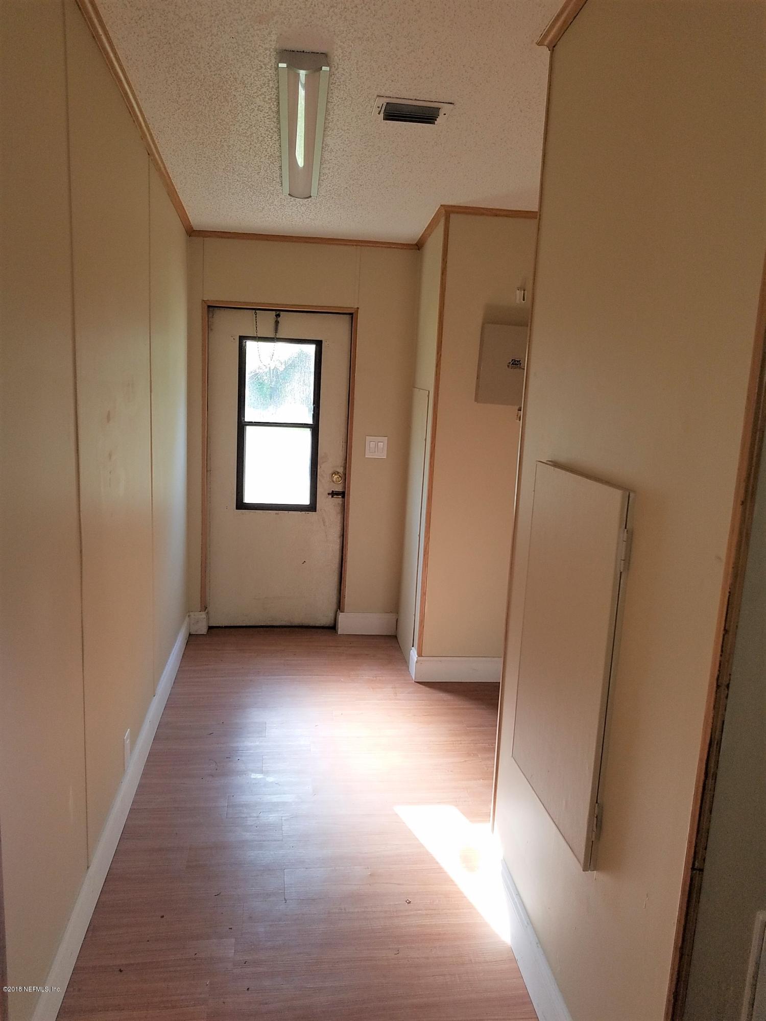 2801 Green Acres Road, Unit EXTENSION St. Augustine, FL 32084 - Photo 21 of 30 an empty room with windows and closet