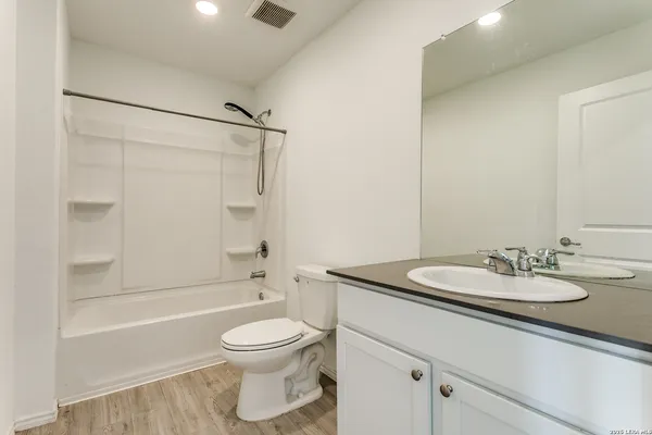 a bathroom with a sink a toilet and a bathtub