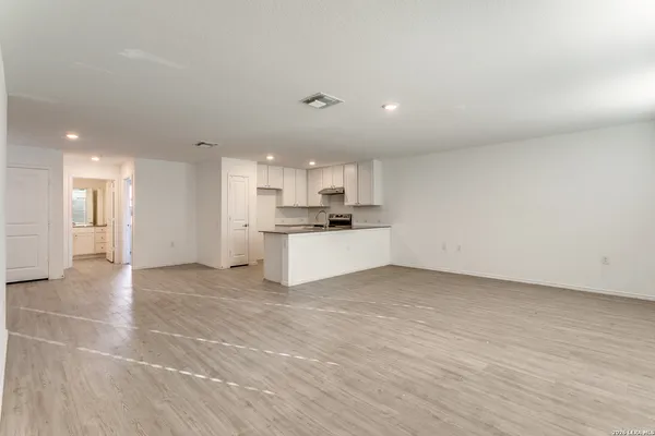a view of a kitchen with a sink and cabinets