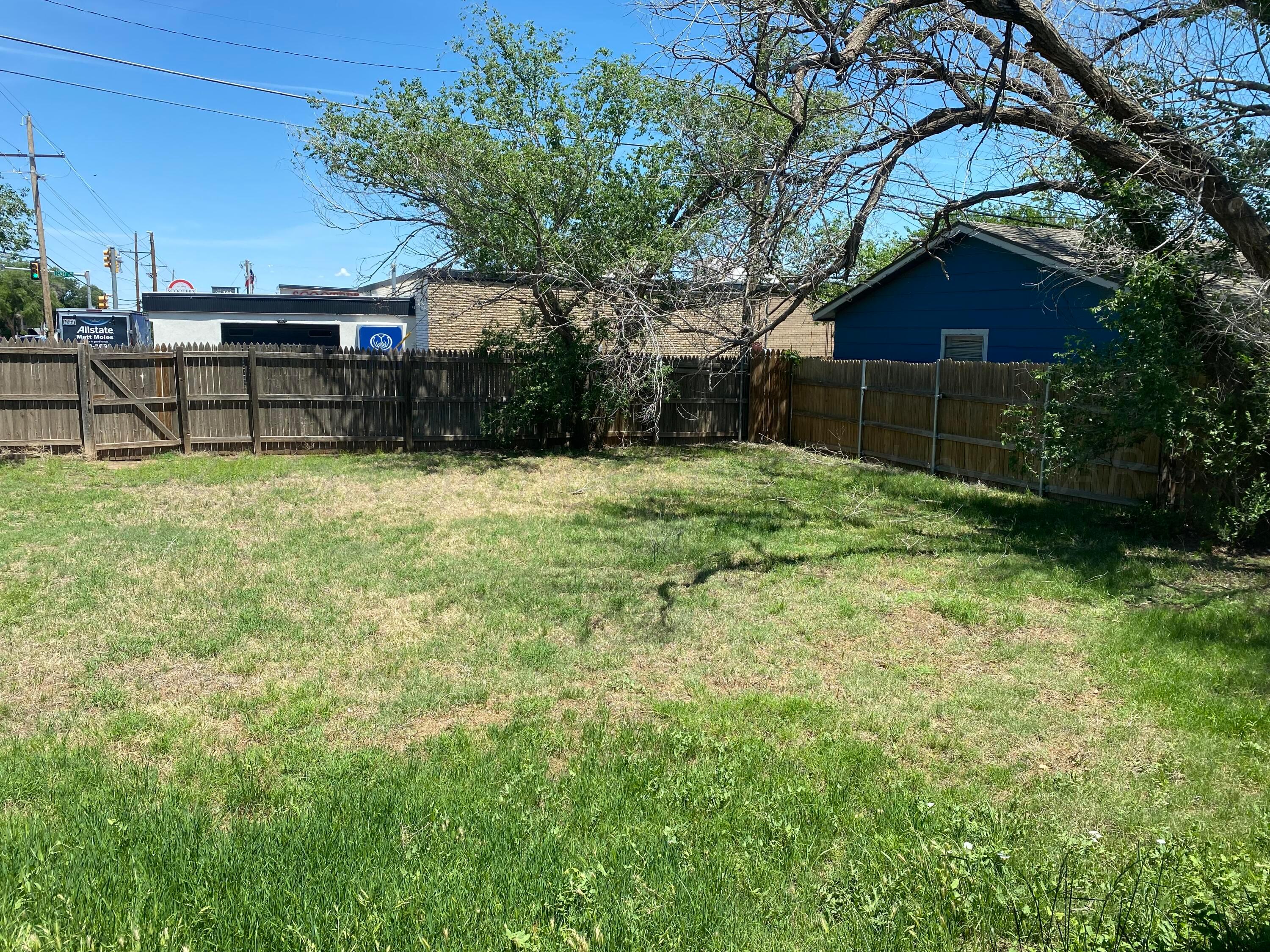 3524 Lometa Drive Amarillo, TX 79109 - Photo 7 of 7 a backyard of a house with table and chairs