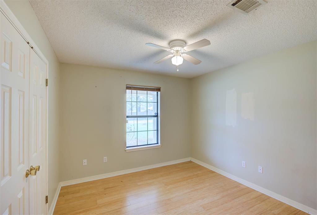 119 Beech Street Homer, LA 71040 - Photo 15 of 21 wooden floor in an empty room with a window