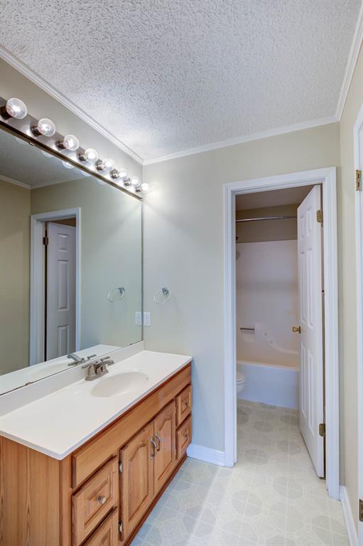 119 Beech Street Homer, LA 71040 - Photo 19 of 21 a bathroom with a sink a vanity and a mirror
