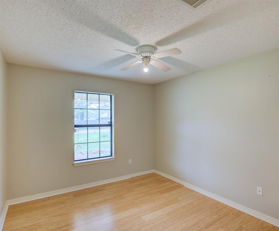 119 Beech Street Homer, LA 71040 - Photo 20 of 21 an empty room with windows and fan