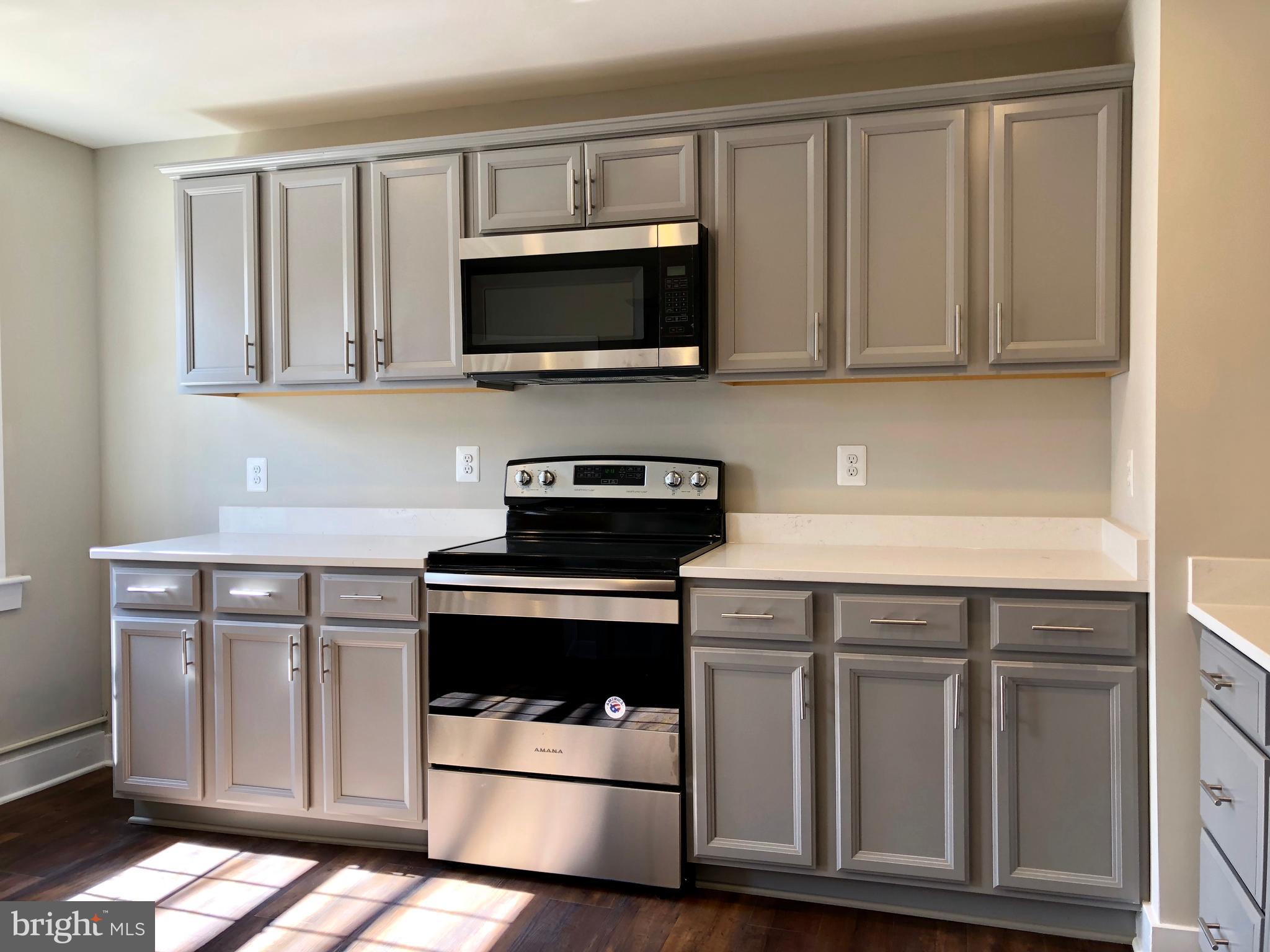 12016 Main Street Libertytown, MD 21762 - Photo 3 of 21 CUSTOM CABINETRY & QUARTZ TOPS - LOTS OF SPACE