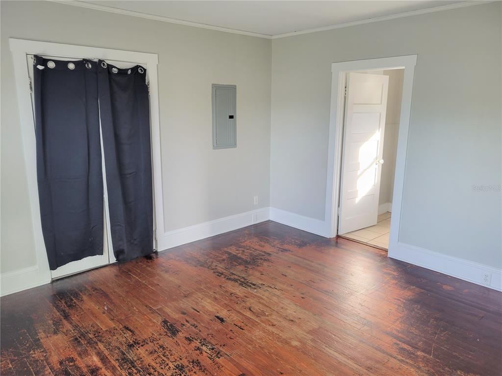 200 Old Daytona Road Deland, FL 32724 - Photo 14 of 23 an empty room with wooden floor and closet area