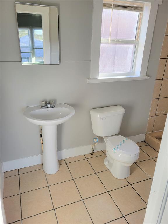 200 Old Daytona Road Deland, FL 32724 - Photo 15 of 23 a white toilet sitting next to a bathroom sink