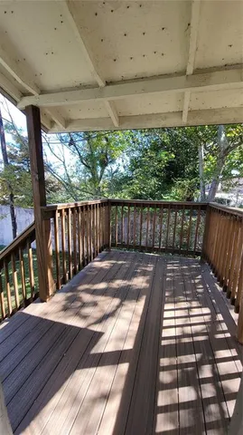 a view of a patio with wooden floor