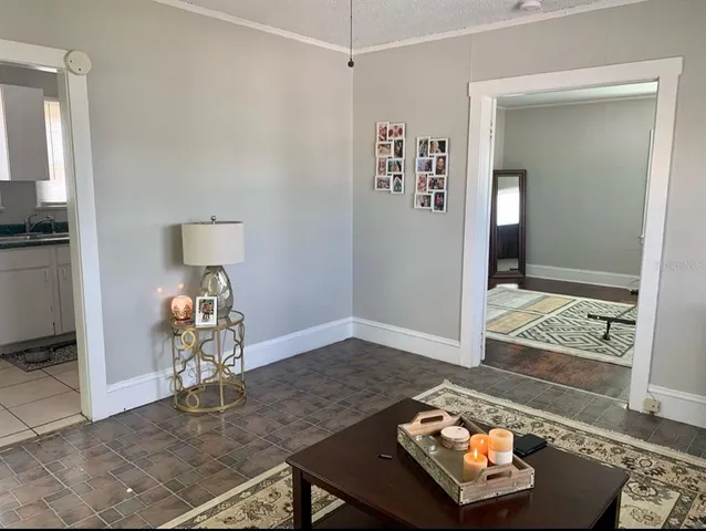 a living room with furniture and next to a window