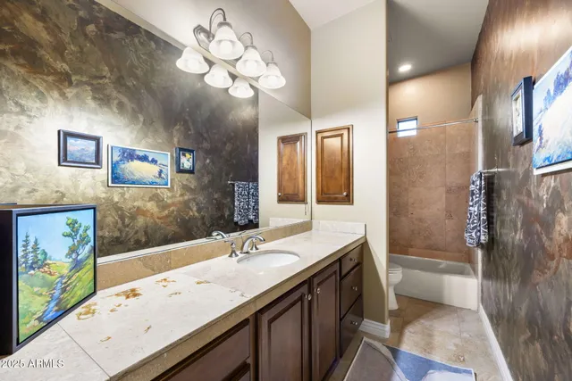 a large kitchen with a large counter top appliances and cabinets