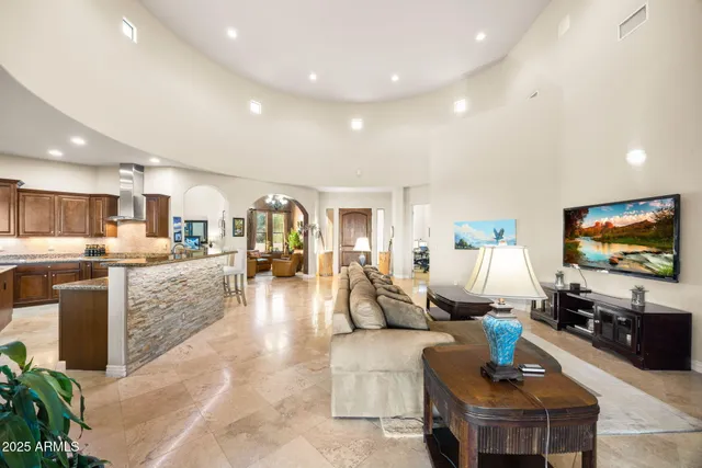 a living room with fireplace furniture and a flat screen tv