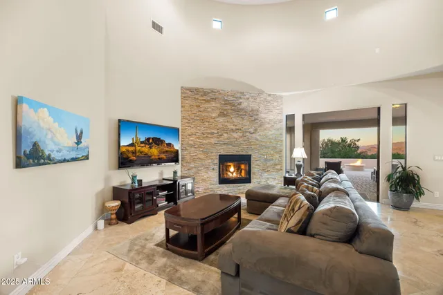 a large kitchen with a large kitchen island a sink a stove a refrigerator and a refrigerator