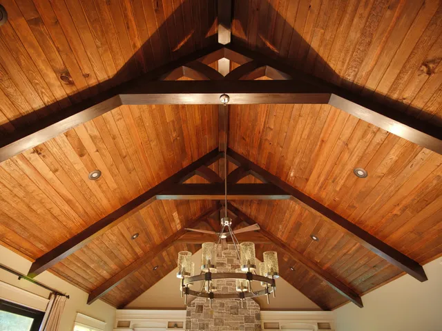 a spacious bedroom with a bed and large windows