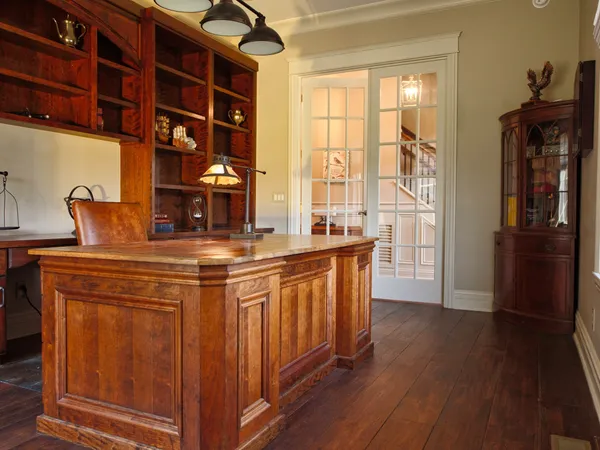 a bedroom with a bed and a night stand