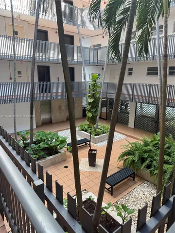 a view of balcony with furniture