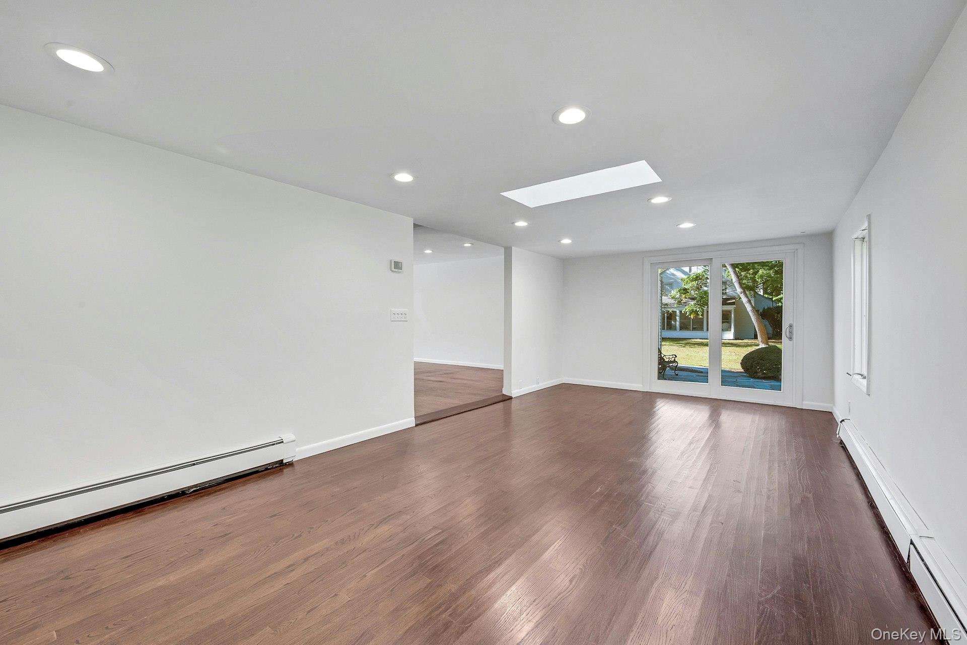 13 Colonial Road Scarsdale, NY 10583 - Photo 11 of 33 Family room with easy access to the backyard