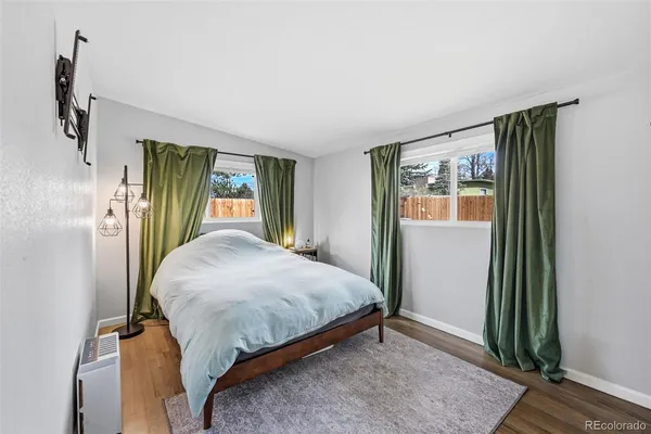 a bedroom with a bed and a glass door