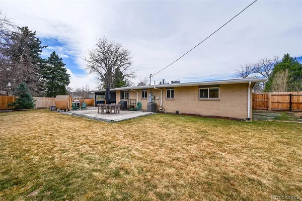 a view of a backyard with sitting area