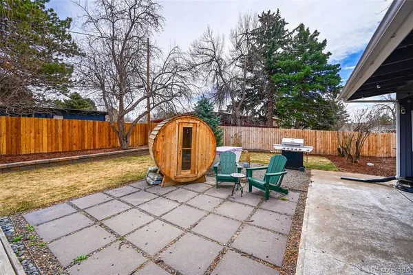 a view of a patio with a table and chairs
