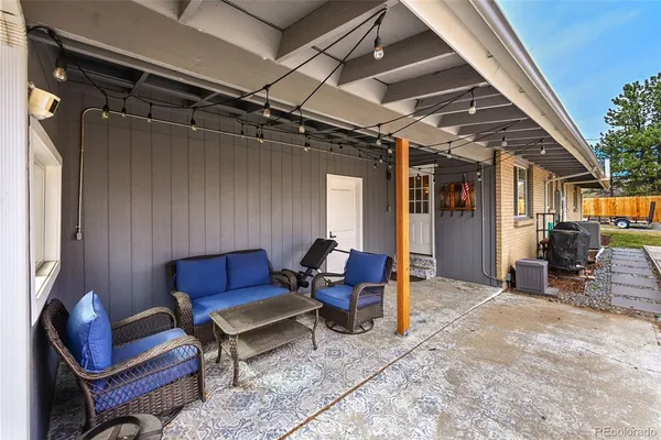 swimming pool view with a seating space