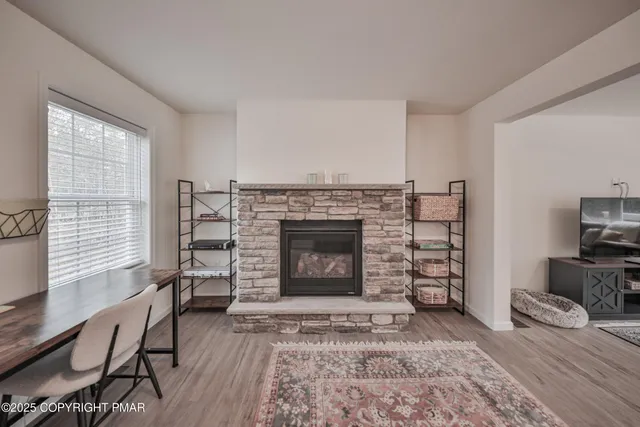 a view of a dining room with furniture and wooden floor