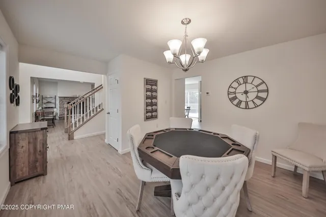 a spacious bedroom with a bed and wooden floor