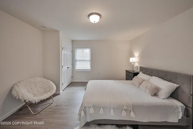 a view of a house with a backyard and sitting area
