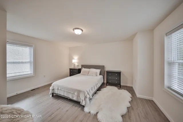 a view of a chair and table in the garden