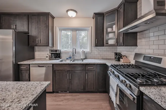 a kitchen with refrigerator and countertop
