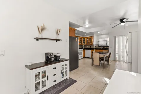 a kitchen with stainless steel appliances a refrigerator and cabinets