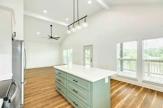 a bathroom with a sink a vanity and a large mirror