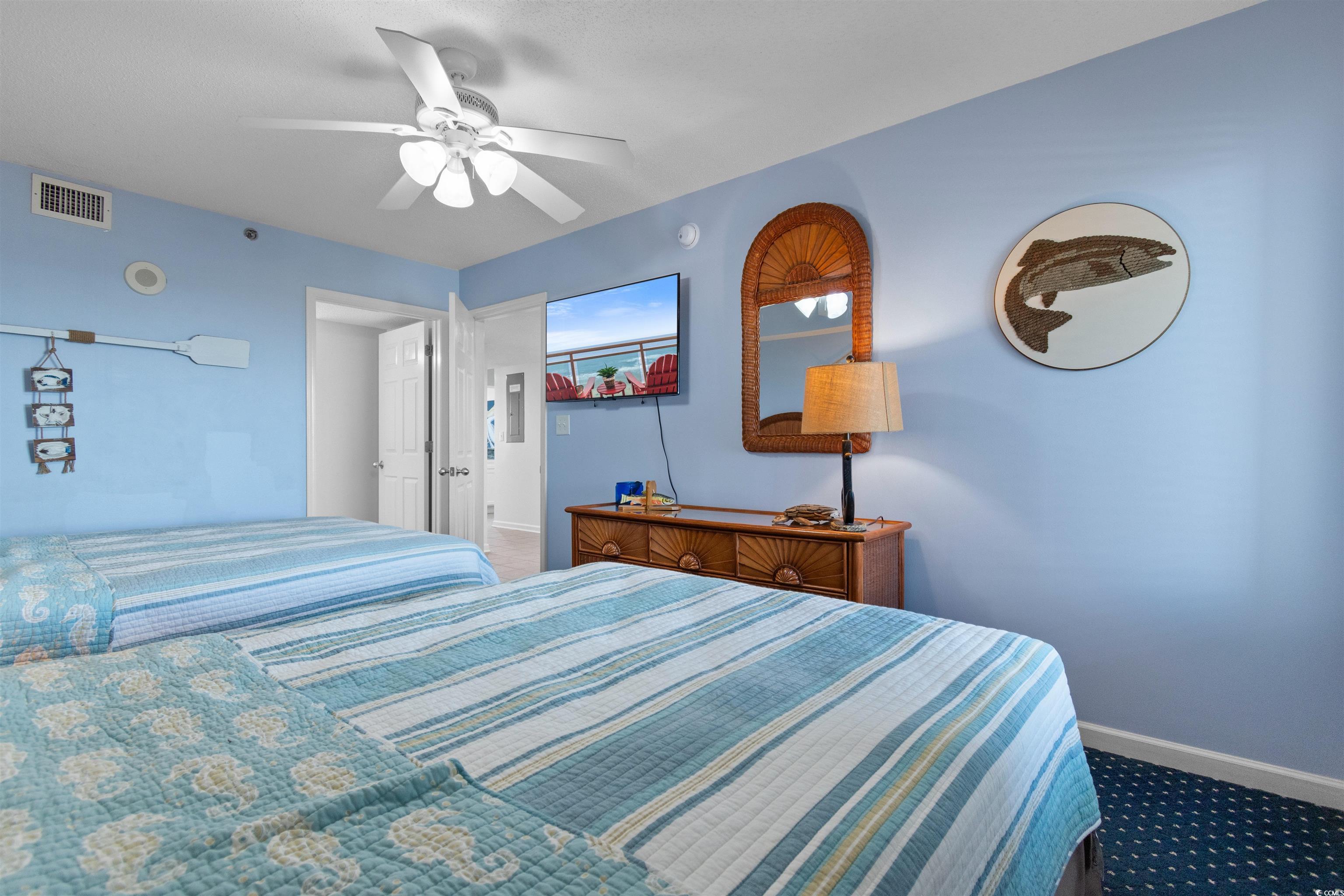 1625 South Ocean Boulevard, Unit 1603 North Myrtle Beach, SC 29582 - Photo 16 of 39 Bedroom featuring carpet and ceiling fan