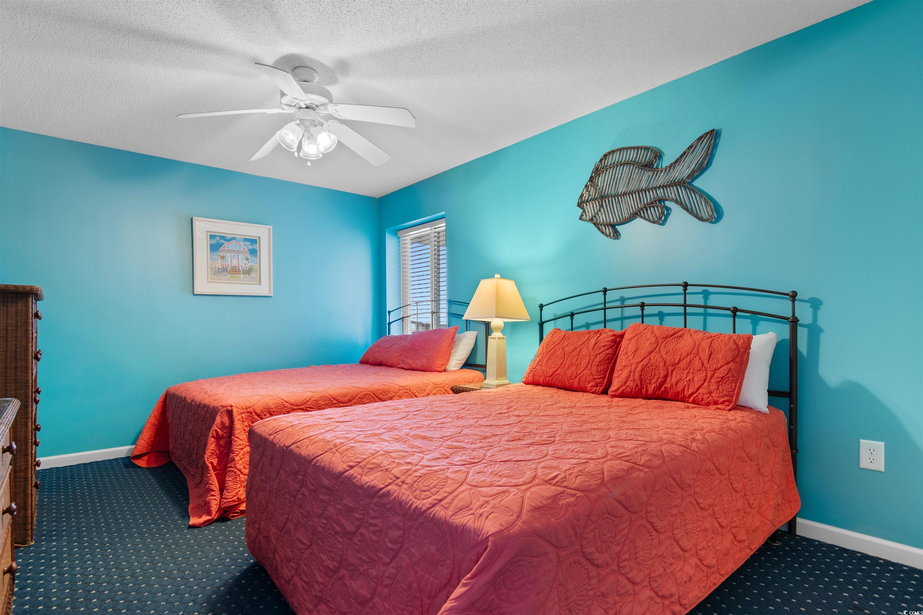 1625 South Ocean Boulevard, Unit 1603 North Myrtle Beach, SC 29582 - Photo 19 of 39 Carpeted bedroom featuring ceiling fan and a textured ceiling
