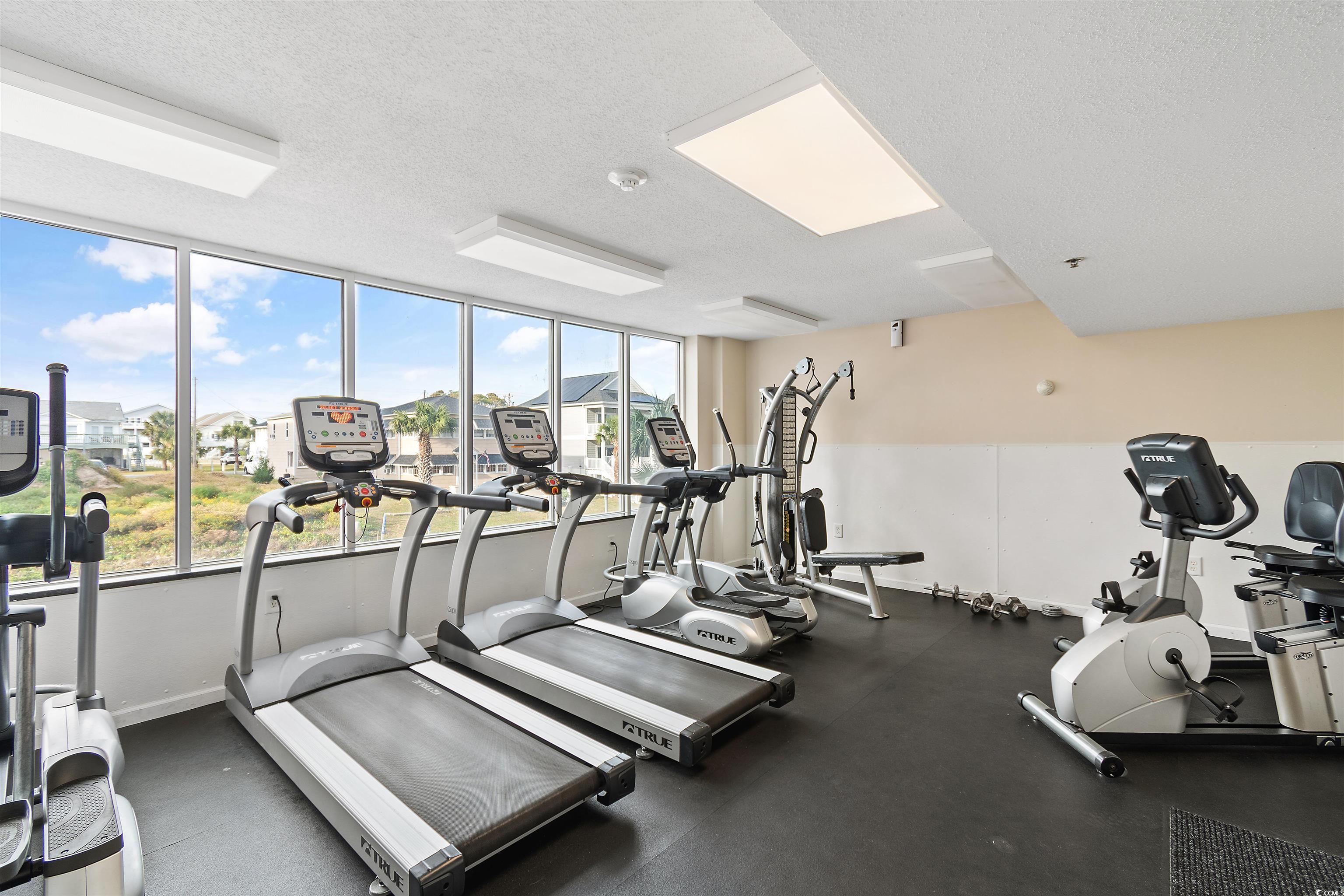 1625 South Ocean Boulevard, Unit 1603 North Myrtle Beach, SC 29582 - Photo 31 of 39 Exercise room featuring a textured ceiling
