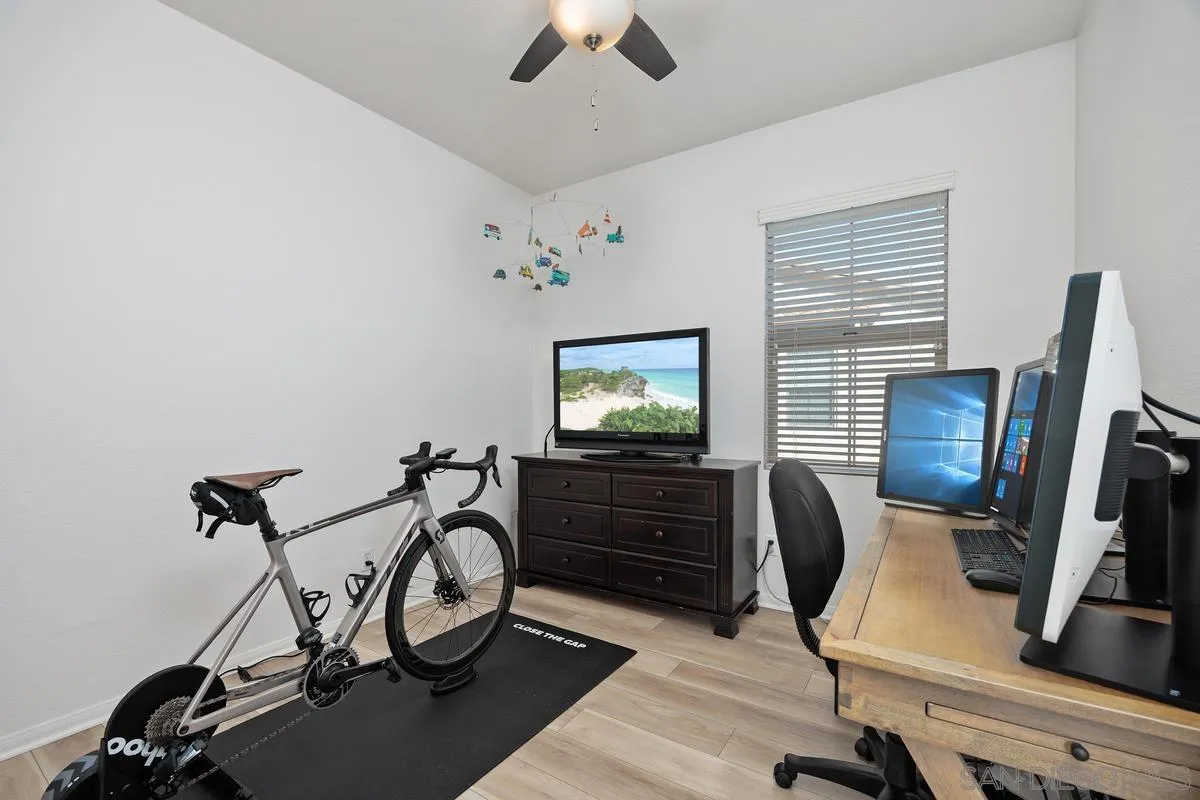 8458 Christopher Ridge Terrace San Diego, CA 92127 - Photo 12 of 41 a view of a workspace with furniture and a window