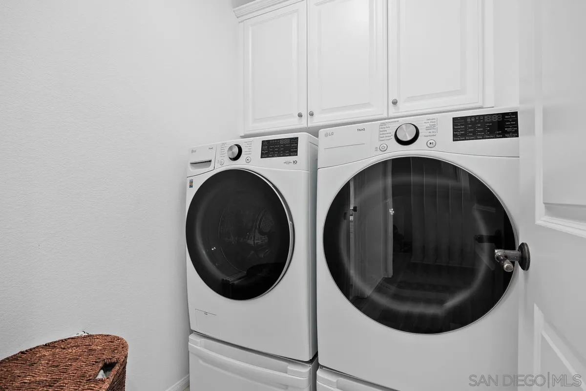 8458 Christopher Ridge Terrace San Diego, CA 92127 - Photo 13 of 41 a utility room with dryer and washer