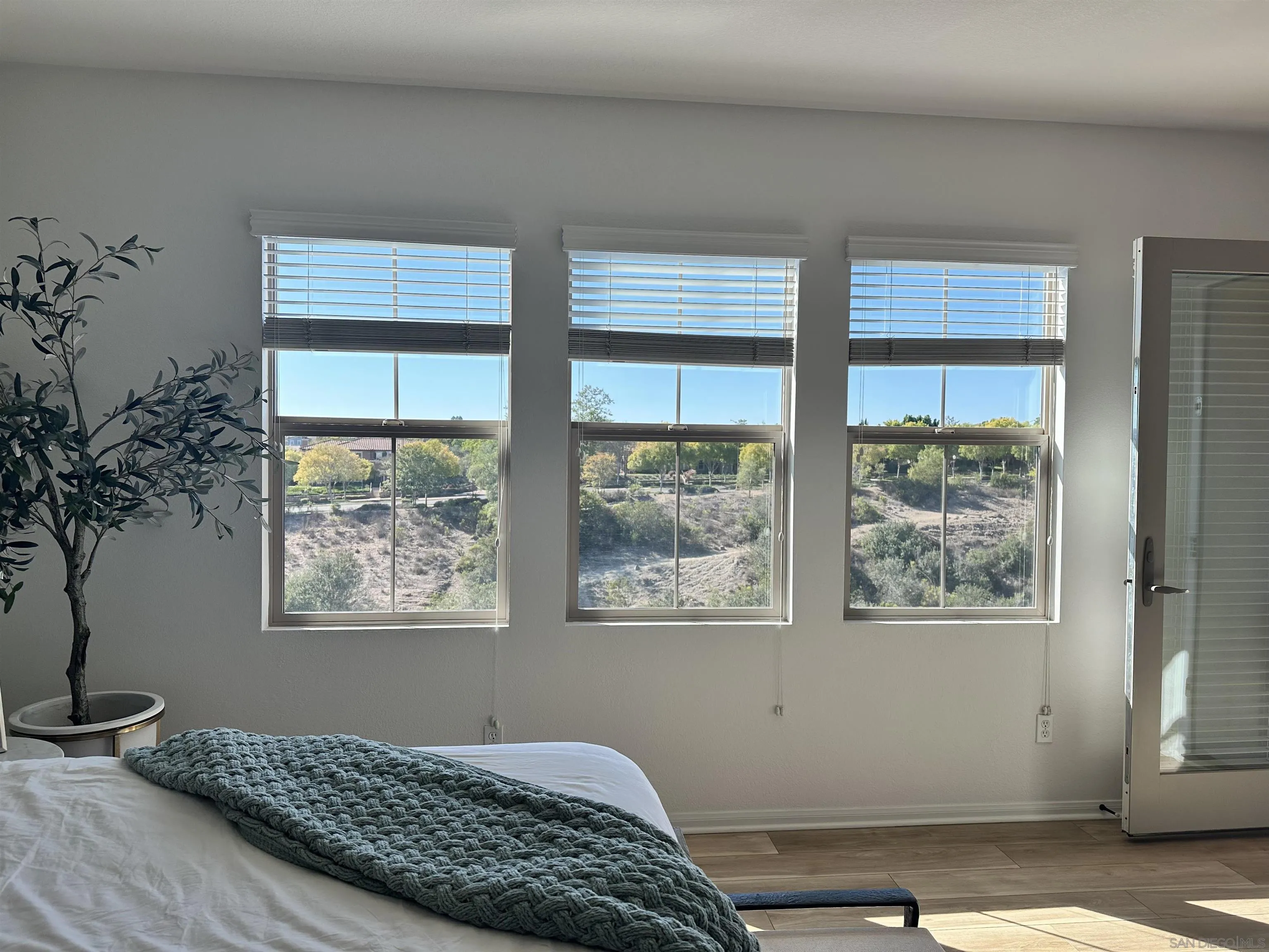 8458 Christopher Ridge Terrace San Diego, CA 92127 - Photo 18 of 41 a bedroom with bed and window