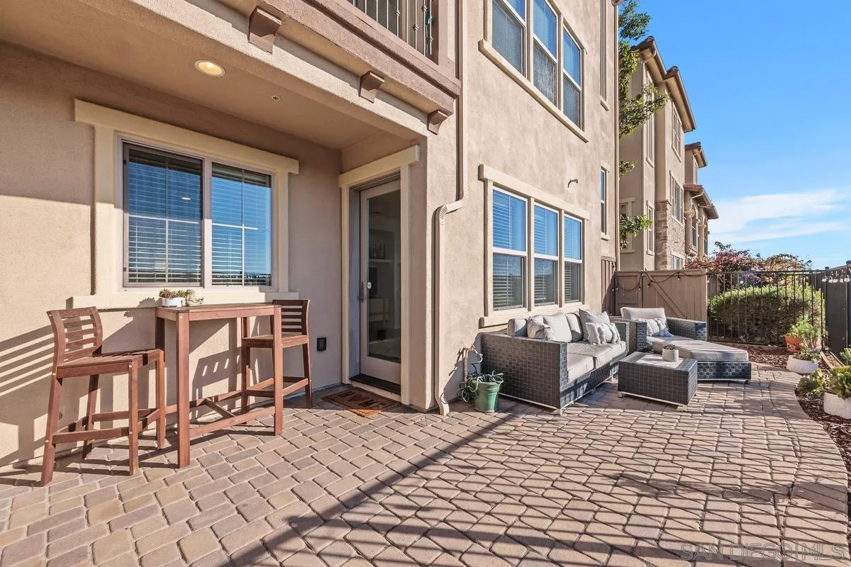 8458 Christopher Ridge Terrace San Diego, CA 92127 - Photo 25 of 41 a balcony with furniture and a potted plant