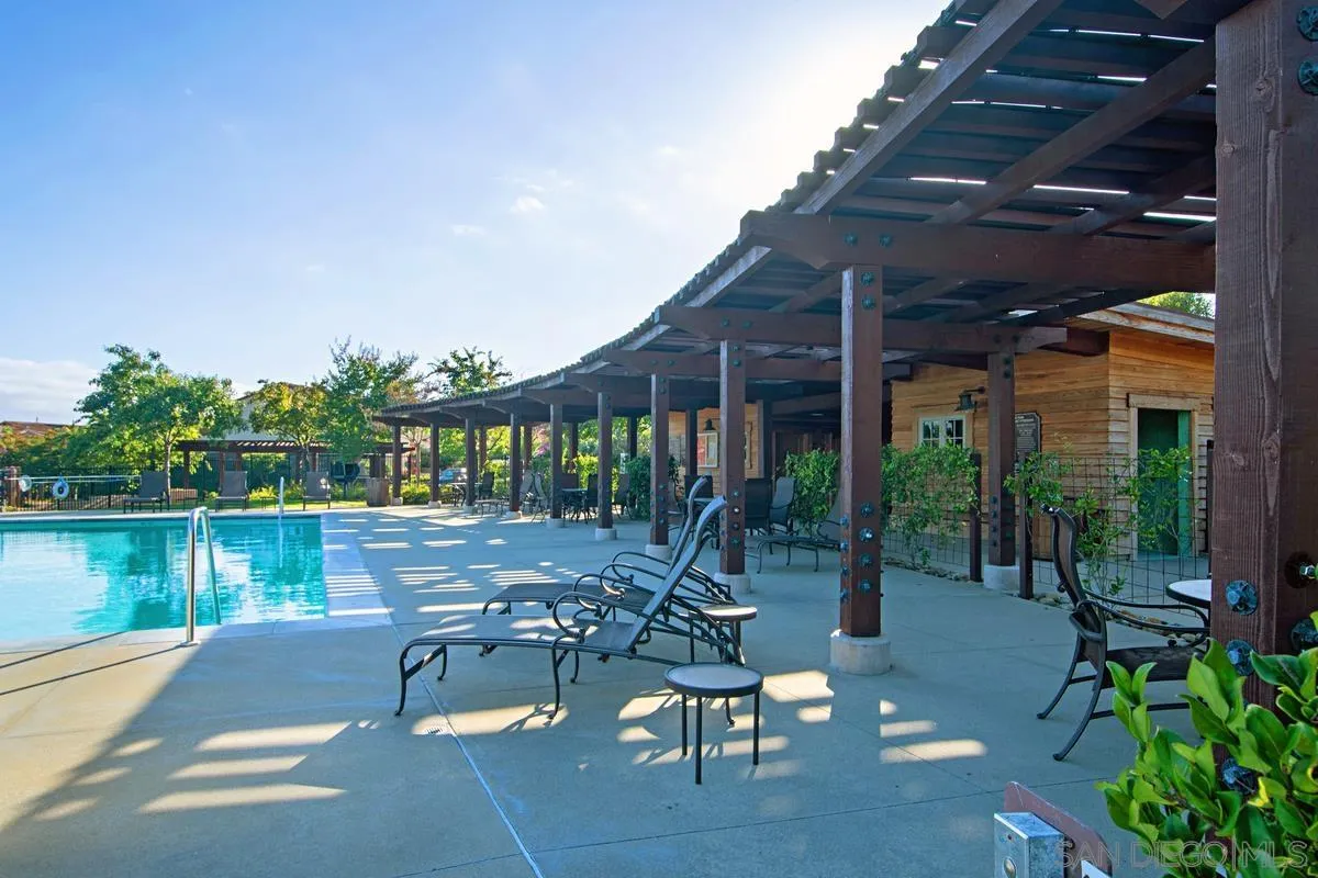 8458 Christopher Ridge Terrace San Diego, CA 92127 - Photo 35 of 41 a view of a patio with chairs and potted plants