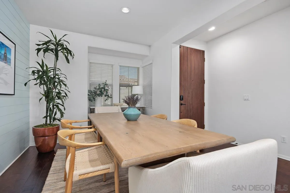 8458 Christopher Ridge Terrace San Diego, CA 92127 - Photo 6 of 41 a living room with furniture and a potted plant