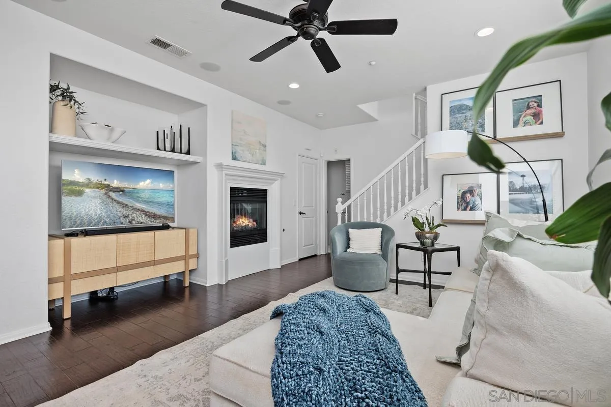 8458 Christopher Ridge Terrace San Diego, CA 92127 - Photo 8 of 41 a living room with furniture and wooden floor