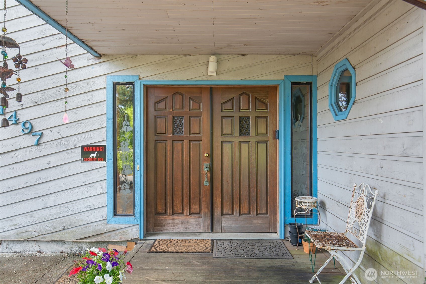 1497 Old Military Road Southeast Tenino, WA 98589 - Photo 3 of 34 a front view of a house with a garden