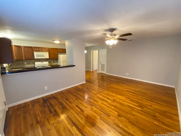 a view of a kitchen with a sink and a microwave
