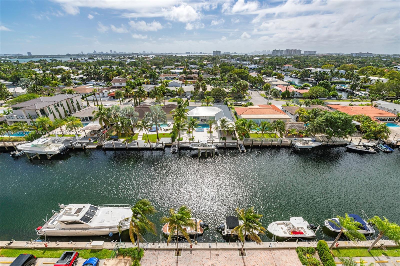 2350 Northeast 135th Street, Unit 1006 North Miami, FL 33181 - Photo 22 of 29 an aerial view of residential houses with outdoor space and a lake view
