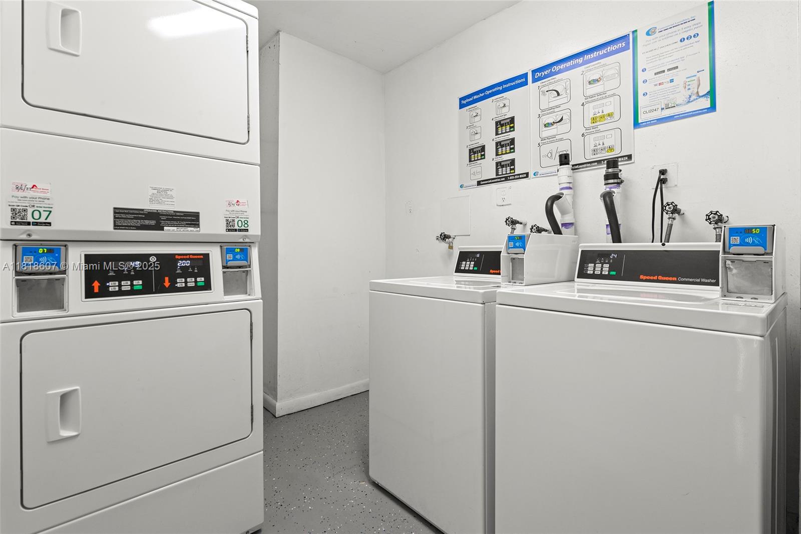 2350 Northeast 135th Street, Unit 1006 North Miami, FL 33181 - Photo 23 of 29 a kitchen with a refrigerator and a sink