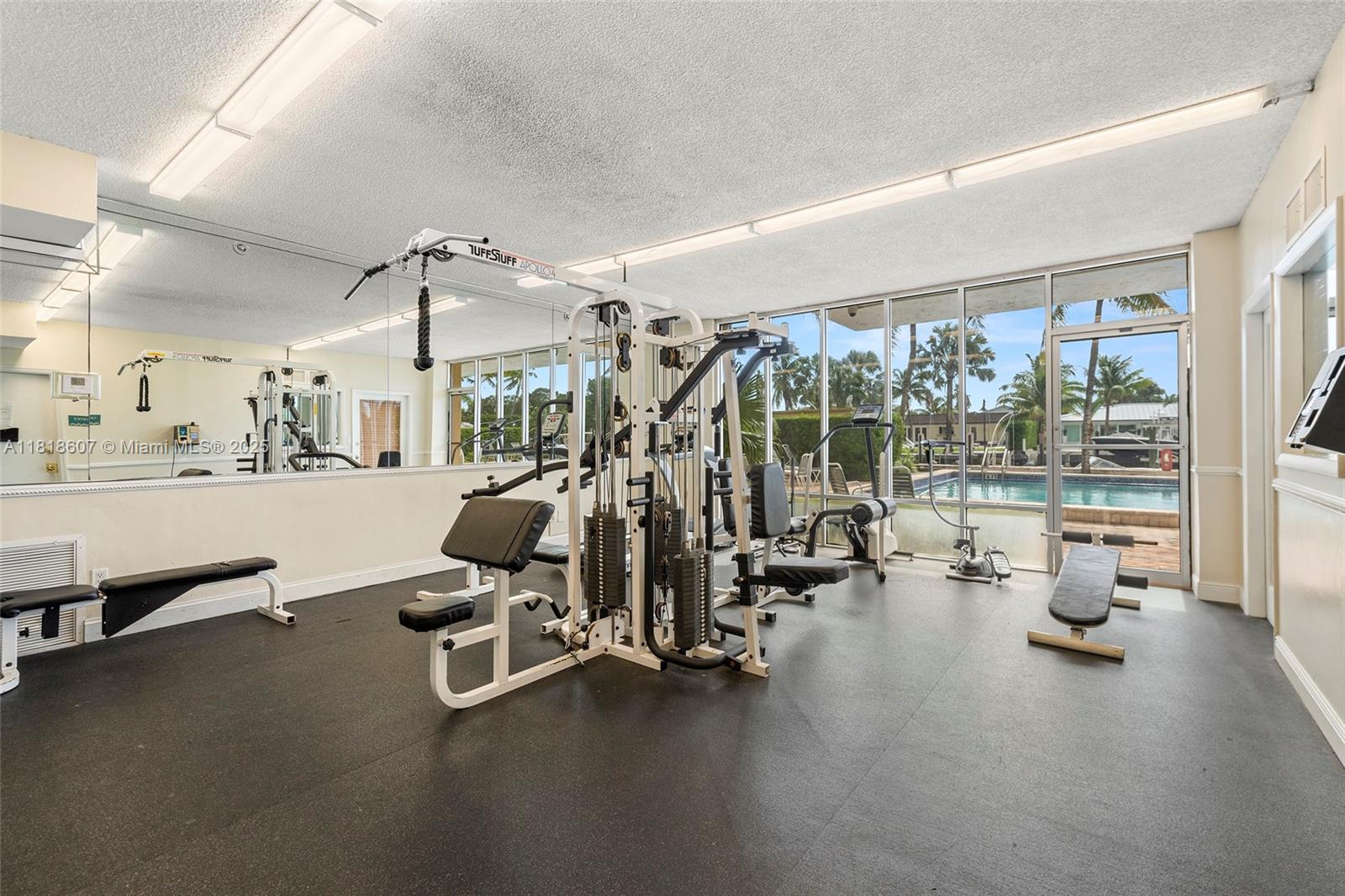 2350 Northeast 135th Street, Unit 1006 North Miami, FL 33181 - Photo 24 of 29 a view of a room with gym equipment